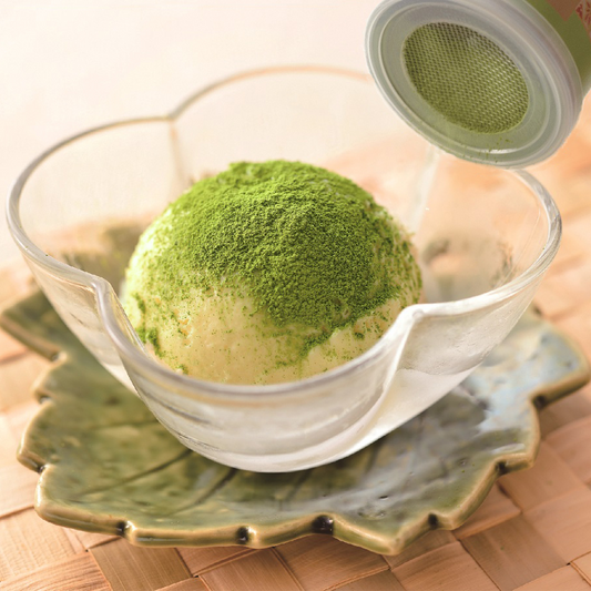 Uji Matcha - Chikiriya Tea House - 30 Gram Tin Can with built in sifter. This image shows the matcha being sifted onto ice cream as a topping.