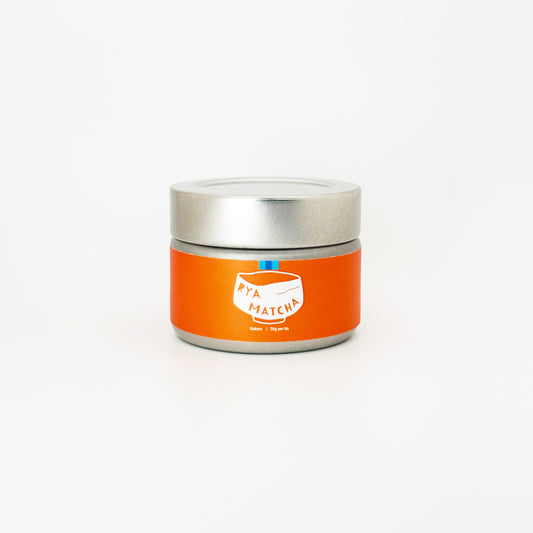 Kokoro Matcha by Rya Matcha. It's in a silver tin with an orange label featuring the Iconic Rya Matcha Logo.
