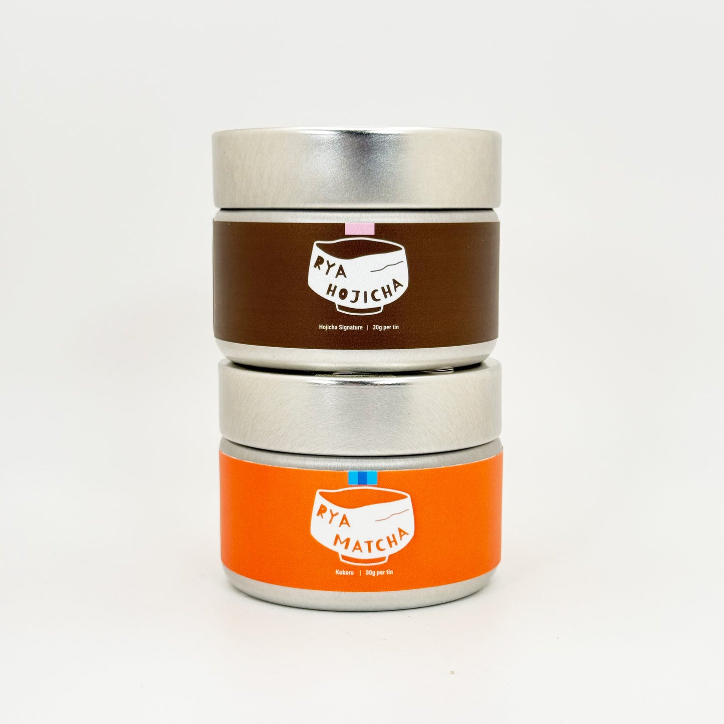 A can of Rya Kokoro and a can of Hojicha Signature stacked on top of each other for the Sweet Ritual Duo