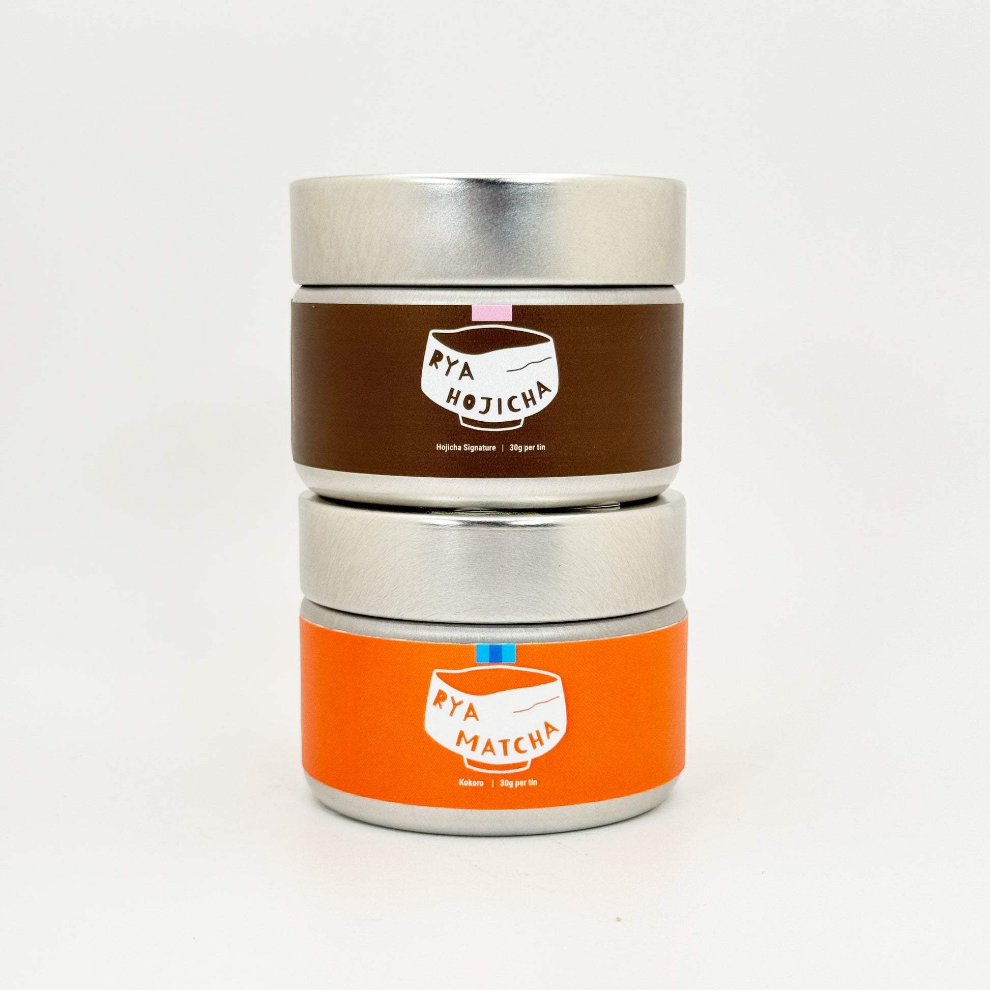 A can of Rya Kokoro and a can of Hojicha Signature stacked on top of each other for the Sweet Ritual Duo