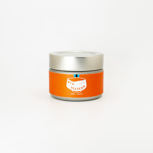 Yabukita Matcha by Rya Matcha. It is in a silver tin with an orange label with the iconic Rya Matcha Logo.